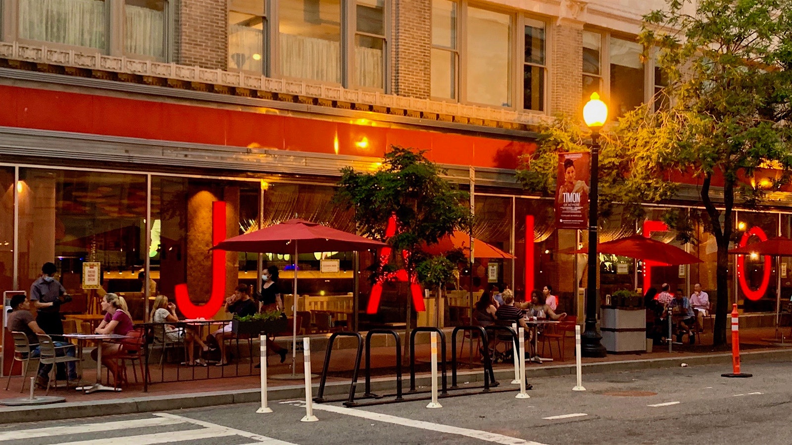 Guests dining at socially distant tables outside Jaleo